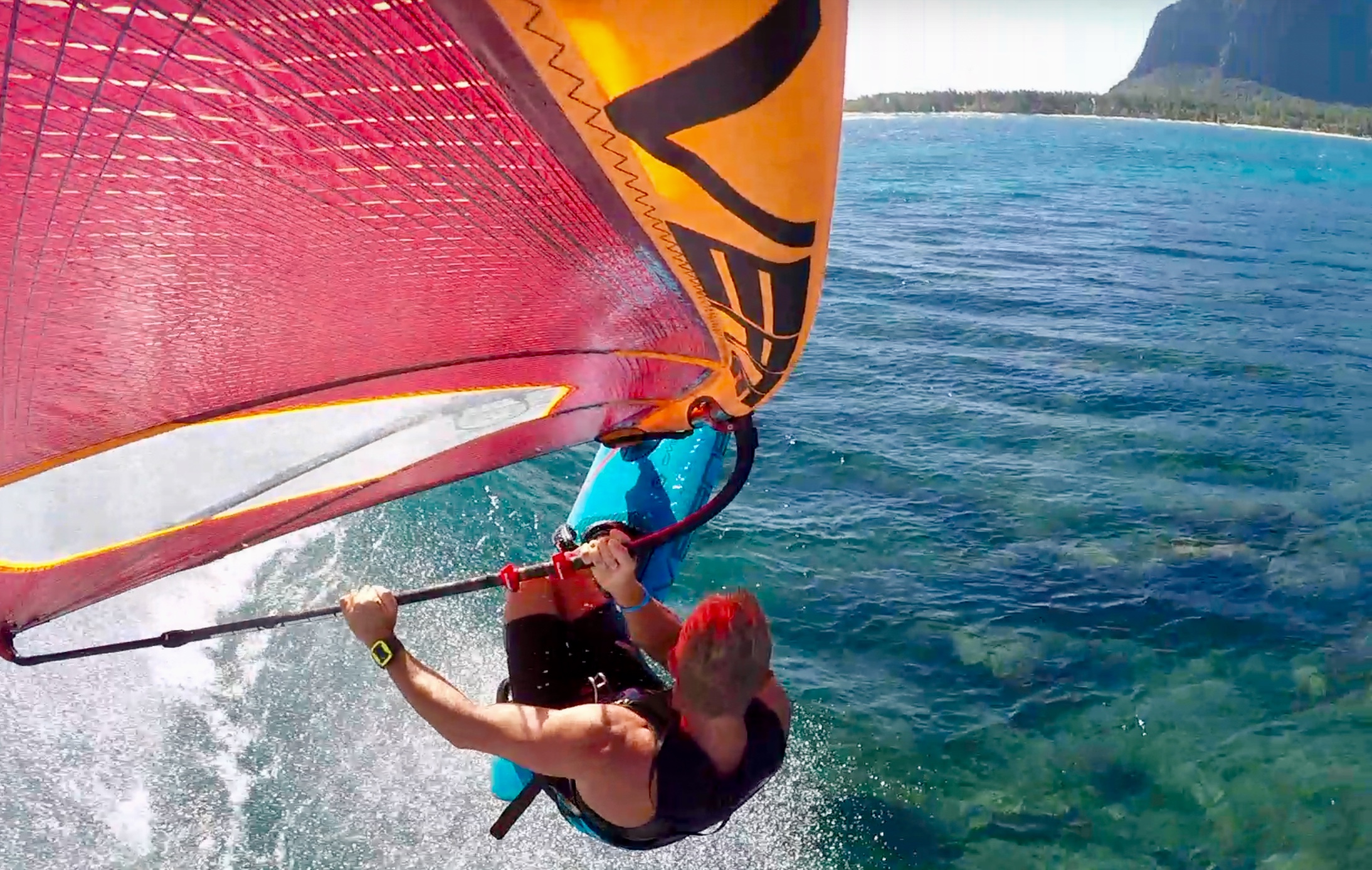 Windsurfing in Mauritius with Le Morne mountain in the background