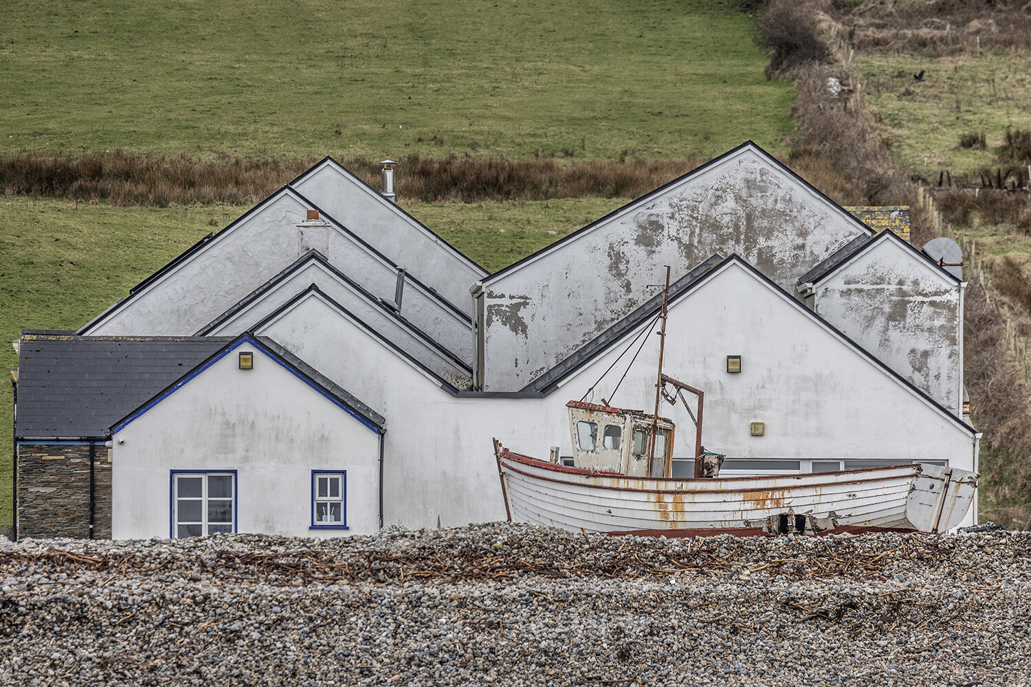 A weathered fishing boat on the beach at Magheroarty